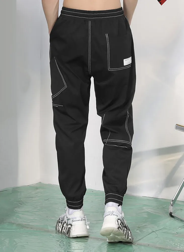 Plain Label Asymmetric Pocket Drawstring Casual Pants